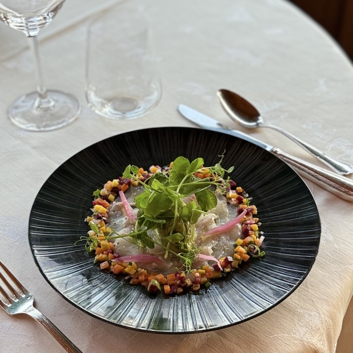 Refined presentation of edible flowers, showcasing the local cuisine at Les Bas Rupts restaurant