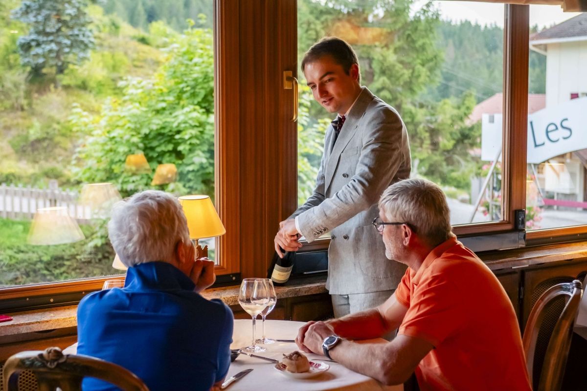 Wine service selected from the prestigious Les Bas Rupts restaurant wine cellar, sharing a moment with the guests