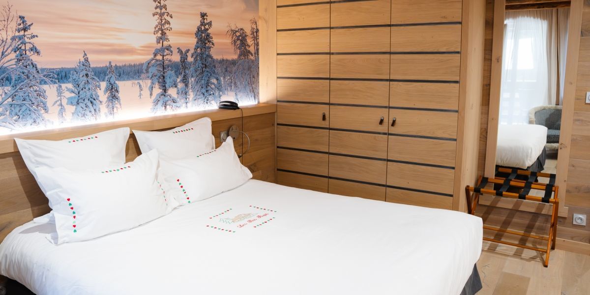 Spacious Prestige room at Hotel Les Bas Rupts, decorated in a mountain chalet spirit