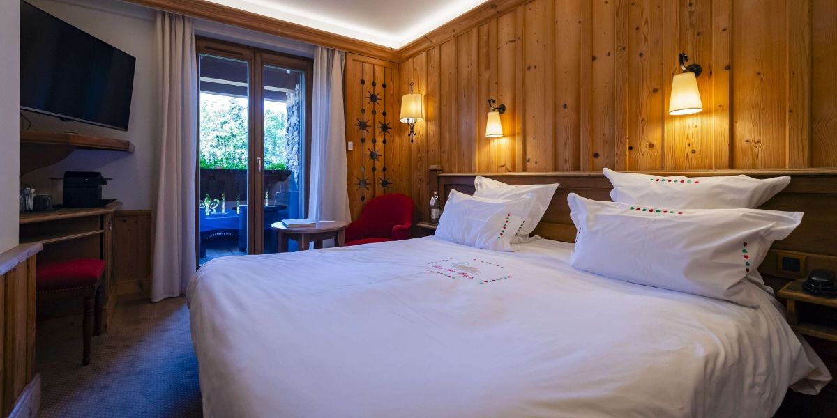 Plume room at Hotel Les Bas Rupts, cozy mountain style with private terrace overlooking the forest